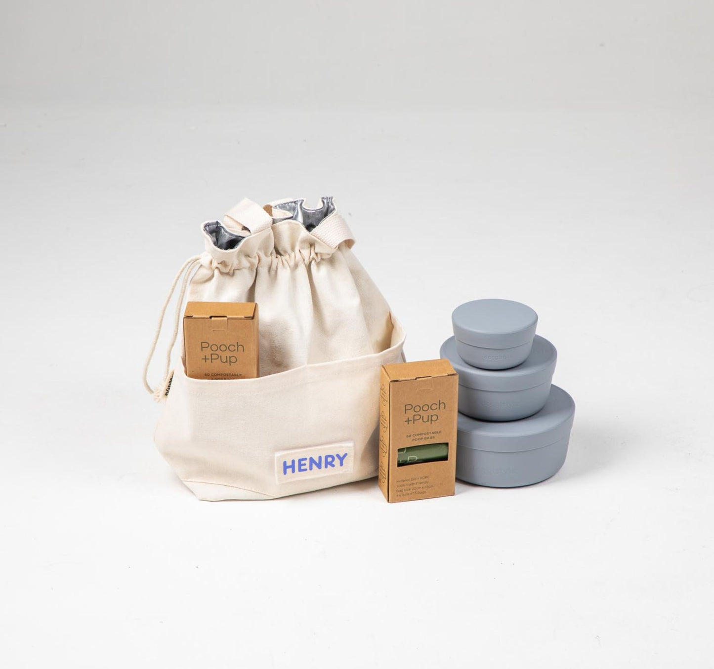 Dog food cooler travel bag & dog food storage containers in blue plus compostable poop bags.