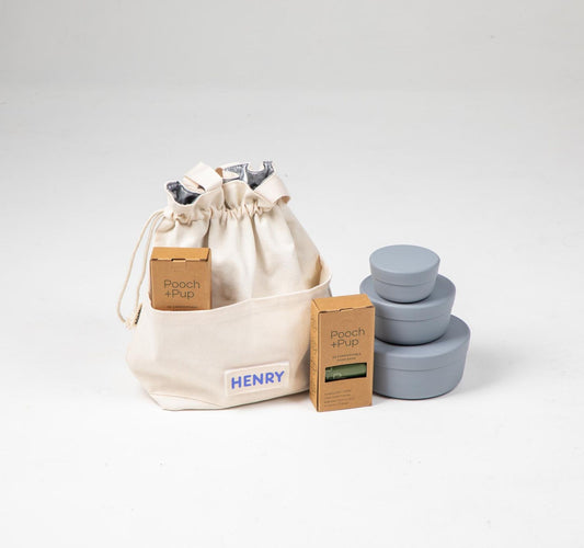Dog food cooler travel bag & dog food storage containers in blue plus compostable poop bags.